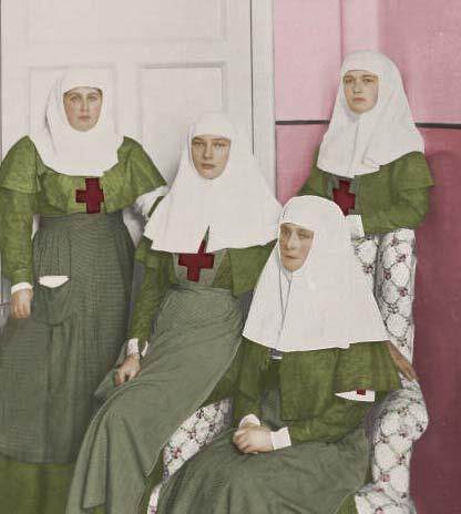 Empress and Grand Duchesses dressed  in   the uniforms of nurses.