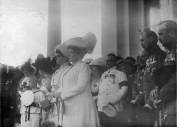 Grand Duchess Maria Pavlovna in a group during a public prayer on the occasion of the opening of the Tsarskoye Selo Jubilee exhibition, Grand Duchess Yelena Vladimirovna standing to the left of  her, Grand Duke Boris Vladimirovich  standing  the last to  the right. Photo: a photograph of Bulla's studio. 10 August 1911. The Central State Archive of Cinema, Photography and Phono  Documents of Saint Petersburg.  D 7158.